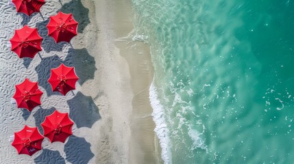 Wall Mural - Red Umbrellas on the Beach: Aerial Photography Along the Sea