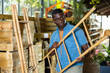 Portrait of african american man choosing bamboo ladder in gardening market