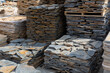 Pallets with stack of natural stone blocks lying at warehouse of building materials