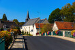 View of picturesque village in France under autumn blue sky..