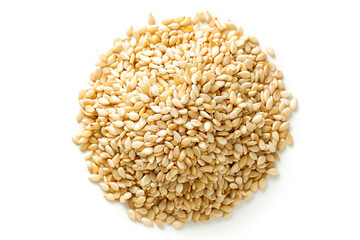 a pile of sesame seeds on a white surface