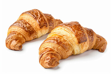 Wall Mural - two croissants are sitting on a white surface