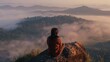 Traveler wearing brown sweater. She sit on top of the mountain looking view sunrise and foggy landscape from the viewpoint alone in the morning.