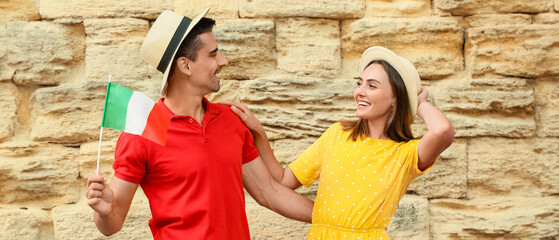 Canvas Print - Young couple with Italian flag outdoors