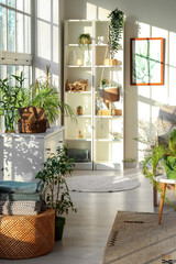 Wall Mural - Interior of light living room with green plants, shelf unit and drawers