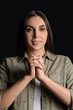 © Pixel-Shot - Beautiful woman praying on black background, closeup