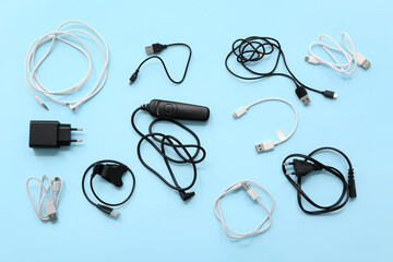 Wall Mural - composition with different usb cables on color background