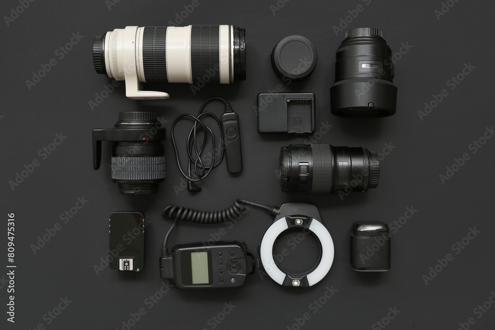 Composition with modern photographer's equipment on dark background