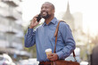 © peopleimages.com - Black man, smile and outdoor with phone call for conversation and communication in New York downtown. Banker, happy and traveling to work with discussion for connection and networking on cellphone
