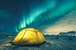 Auroras Illuminate the Winter Night Sky Above a Lone Camping Tent