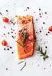 Fresh Salmon Fillet With Herbs and Spices on a White Marble Surface