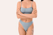 © Pixel-Shot - Beautiful young woman in light blue underwear on white background