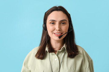 Canvas Print - Female technical support agent in headset on blue background