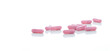 Pink capsules pill spread on white background. Prescription drug. Pharmaceutical industry. Vitamin and supplement capsule. Pharmacy store banner. Pharmaceutical industry. Healthcare and medical care.