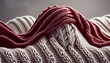 Detailed view of a knitted woolen sweater in a rich burgundy, highlighting the complex weave 
