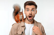 surprised man with squirrel on his shoulder on white background