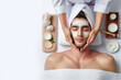 man receiving facial and massage at luxury spa for relaxation on white background