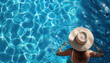 © WD Stock Photos - Woman wearing sun hat relaxing in swimming pool