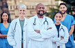 © peopleimages.com - Team, doctors and outdoor portrait of collaboration, diversity and confidence in healthcare management. Together, unity and proud of medical service, support and trust in solidarity or commitment