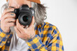 Close-up of a photographer taking a photo on a white or transparent background