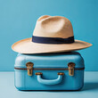  blue suitcase and hat