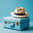 Blue suitcase with hat