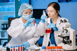 © Nuttapong punna - Young scientists conducting research investigations in a medical laboratory, a researcher in the foreground