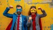 Businessman and woman wearing superhero masks and capes pose against a textured wall