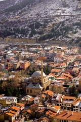 Wall Mural - 4 February 2024 Afyonkarahisar Turkey. Afyonkarahisar castle and Afyon cityscape from castle on a cloudy winter day