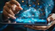 © Антон Сальников - Cloud storage service concept. A person holds a tablet PC with an array of online services on it. He touches the cloud icon.