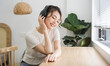 © Q88 - Portrait of beautiful young Asian girl at home