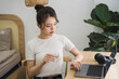 © Q88 - Portrait of asian girl working at home