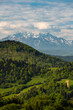 Green hills of Pieniny National Park and snowy Tatra Mountains in background in Poland