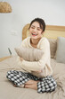 © Q88 - Portrait of beautiful young Asian girl at home