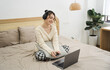 © Q88 - Portrait of beautiful young Asian girl at home