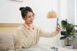© Q88 - Portrait of beautiful young Asian girl at home