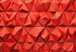 A close-up view of a 3D geometric pattern with a textured, triangular design in red