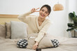 © Q88 - Portrait of beautiful young Asian girl at home