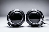 Fototapeta Do przedpokoju - Two black headphones with a cord attached to them