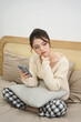 © Q88 - Portrait of beautiful young Asian girl at home