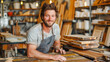 © João Macedo - Smiling craftsman posing inside his woodworking shop, surrounded by handmade wooden items