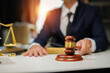 © maeching - judge on wooden table And experienced lawyers meet with clients and give advice behind the scenes. legal services legal consulting concept