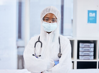 Portrait, black woman or doctor with ppe, mask and gloves in hospital for safety, covid research and vaccine. Protection, female person or healthcare worker in clinic for security, hygiene or shield