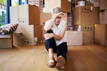 Mature woman, tired and boxes in new home, burnout and exhausted on floor, moving and sad for leaving. Rent, apartment and person in property, rest and thinking of mortgage of house, stress and wood