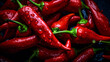 Red hot chili peppers with water drops on black background, close up