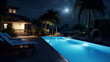 Swimming pool at night with palm trees and full moon in the background