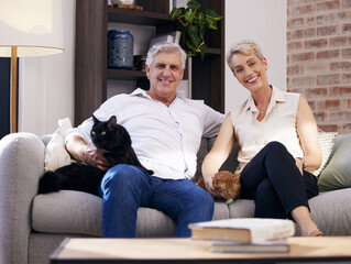 Poster - Portrait, senior couple and cat pets on sofa in living room of home together for retirement. Happy, love or smile with elderly man, woman and animals in apartment for bonding or to relax on weekend