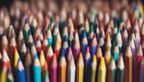 Fototapeta  - colored pencils lined up next to each other, isolated white background

