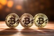 Gold bitcoins on bokeh background
