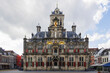 historic facade of the town hall on the market square in Delft